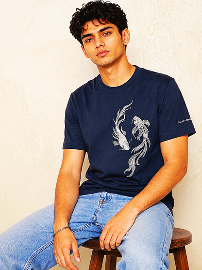 Navy koi embroidered t-shirt seated lifestyle – 13thirtystudios Calm Chaos